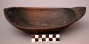 Dish, carved wood, ovate with pointed ends, flat base, mended