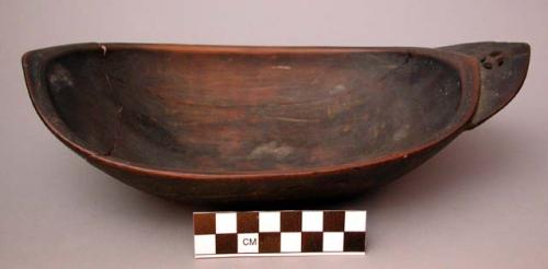 Dish, carved wood, ovate with pointed ends, flat base, mended