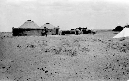 Tent and huts in desert