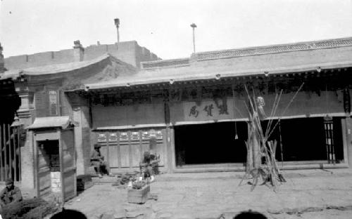 People sitting outside building