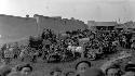 Crowd of people and carriages in road