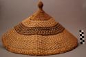 Hat; conical, finial on top.
