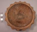 Carved light-colored wooden bowl with scalloped edges, greatest diameter: app. 1