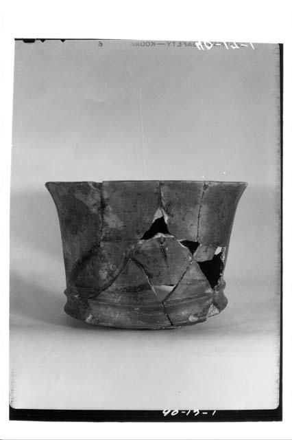 Black ware, tripod vase.  Intermediate period.