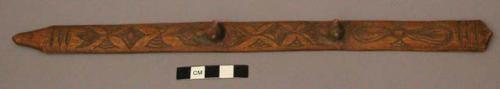 Carving, carved wood stick, oblong, fluted end, bear heads in relief