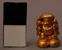 Two Small Lead Figures with Gilt Cast in a Small Square Wooden Box with a Lid