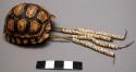 Tortoise shell ornament with ostrich egg shell decoration - worn by women; conta