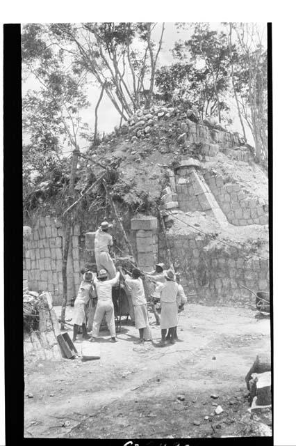 Small South Temple - repairing fallen round column in front of temple