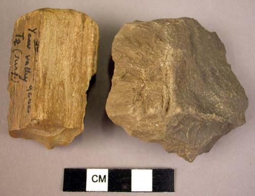 2 roughly flaked objects of fossil wood