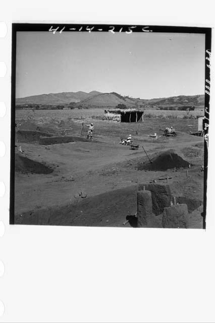 Three photos in panorama of work in progress in E side of Mound 1 from stake N64