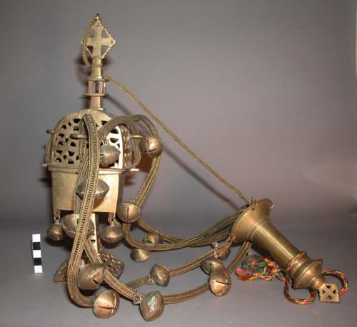 Brass incense burner with brass bells on brass ropes attached to brass handle