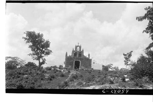 Church from distance looking S.