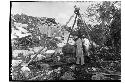 Platform of the Cones - repairing Chac Mool on E. side