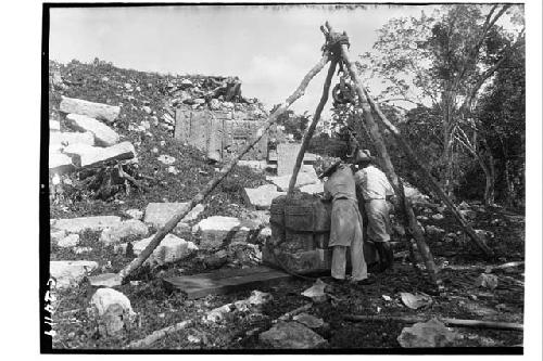 Platform of the Cones - repairing Chac Mool on E. side