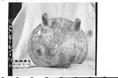 Tetrapodal polychrome pottery bowl.