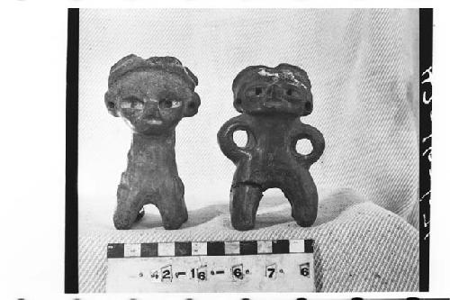 Two small solid pottery figurines
