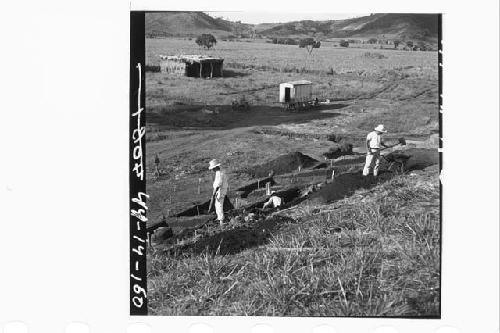 Excavation on W side of mound and in S. plaza to NW from W Ph. III steps.  Mound