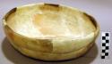 Ceramic bowl, yellow slip, impressed exterior, reconstructed