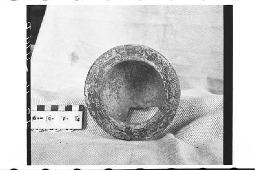 Fragmentary tripodal polychrome pottery bowl.