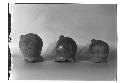 Three large legs of lost color tetrapod dishes.  Pre-Acropolis period.