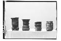 Pottery vessels (4).  1-(Left) Pol. red tripod-rattles in feet-app. a single plu