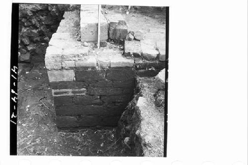 Construction of west wall and top of cut stone block platform at NW corner.  Fro