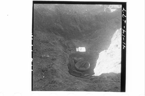 Potsherds near NE corner of Ph. I, 1.6' above floor in sect. N68.3W.  Md. 1-NE.