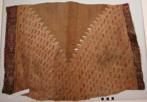 Organic, textile, rows of repeating bird motif, geometric pattern borders, slit