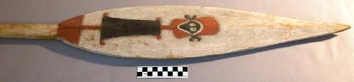 Wooden paddle - blade painted with white human-like figure on one side