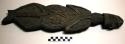Wooden palette in form of human figure, black stain, carved both sides. Head fac
