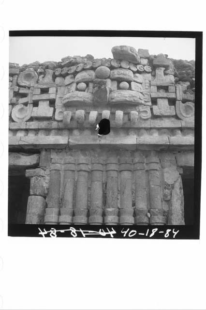 Mask, S. facade of palace 2nd story