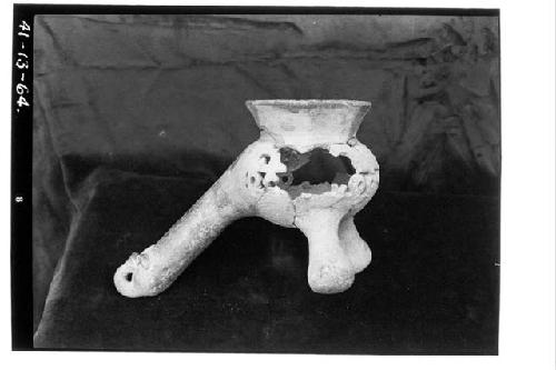 Pottery; fragmentary incense burner, perforated, found above floor in cross pass