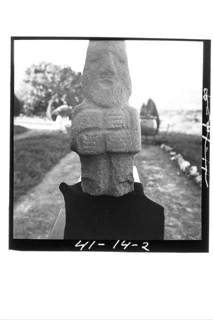 Front view, small standing stone human figure f found on Altar A.  Mound 1-N.  S