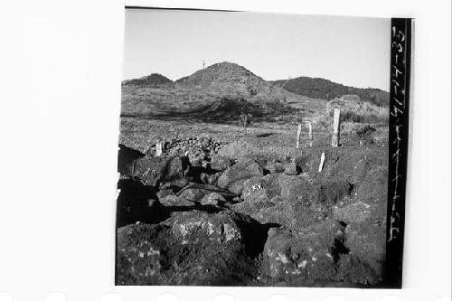 Sections N19-21.15E showing talpetate rock fill near present surface of mound.