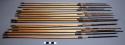 Bundle of 19 wooden arrows each with metal tip; tips bound by thin strips of bar