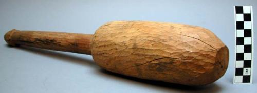 Wood pestle, roughly carved, length 19.25 in.