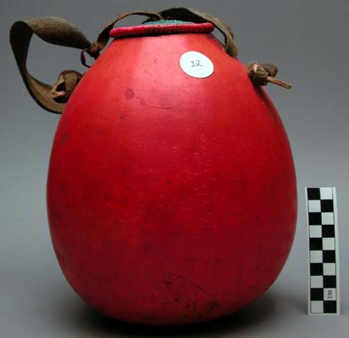 Gourd container, red, grn/pk coiled basketry lid, hide handle & hinge, lid stuck