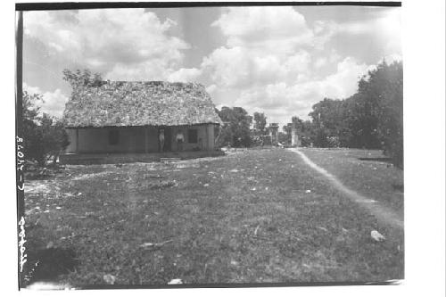 People standing on porch of finished Morris House