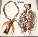 Necklace, multicolor glass bead strands, metal bells, animal hair pendant