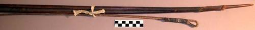Large bow of dark wood and incised designs