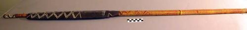 Wooden war club - decorated for ceremonial purposes. Handle woven +