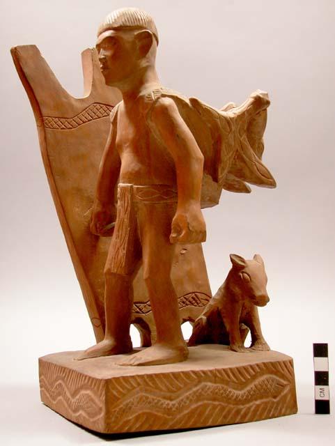 Carved human figure and animal (male) - wood