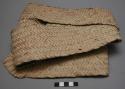 Strip of woven milala ready to make grain bag (or mats) - representing one stage