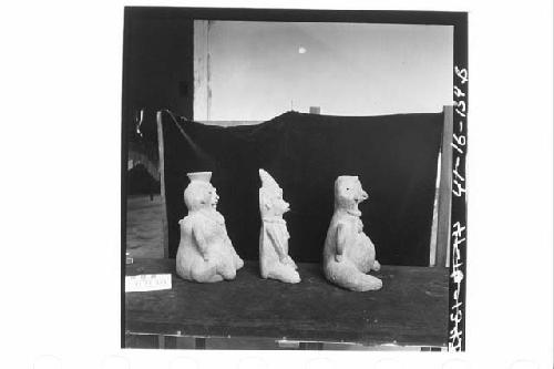 Three Seated Anthropomorphic Female Figurines of Coarse Dark-Brownish Clay