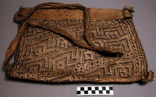 Women's carrying basket ("yut"). Decorated with black geometric design.