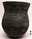 Round-based clay pot with incised decoration - used for cooking