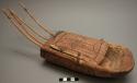 Harp, wood; decoration is incised, black, geometric-shapes and animals 4 strings