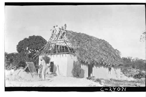 Morris House - walls up - partially thatched - looking Northwest