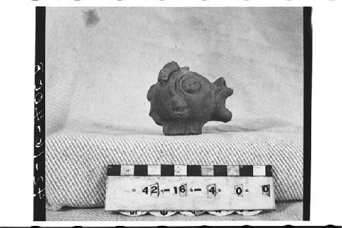 Head of pottery animal-effigy figurine or whistle (ocarina type?)