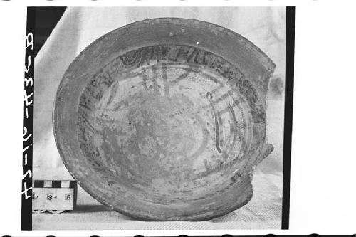 Tetrapodal polychrome pottery bowl.